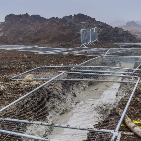 Muddy field with a slurry wall running through it | Bentonite MS