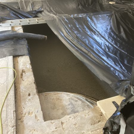 Tarp covering a swimming pool during an infill with foam concrete | Bentonite MS